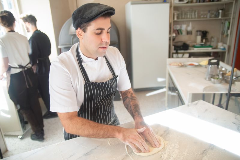 Mod Pizza kitchen crafting fresh handmade pizzas